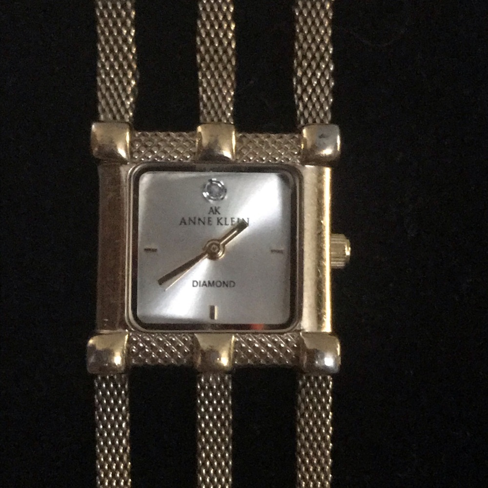 COPY - Anne Klein gold watch with diamond on face.